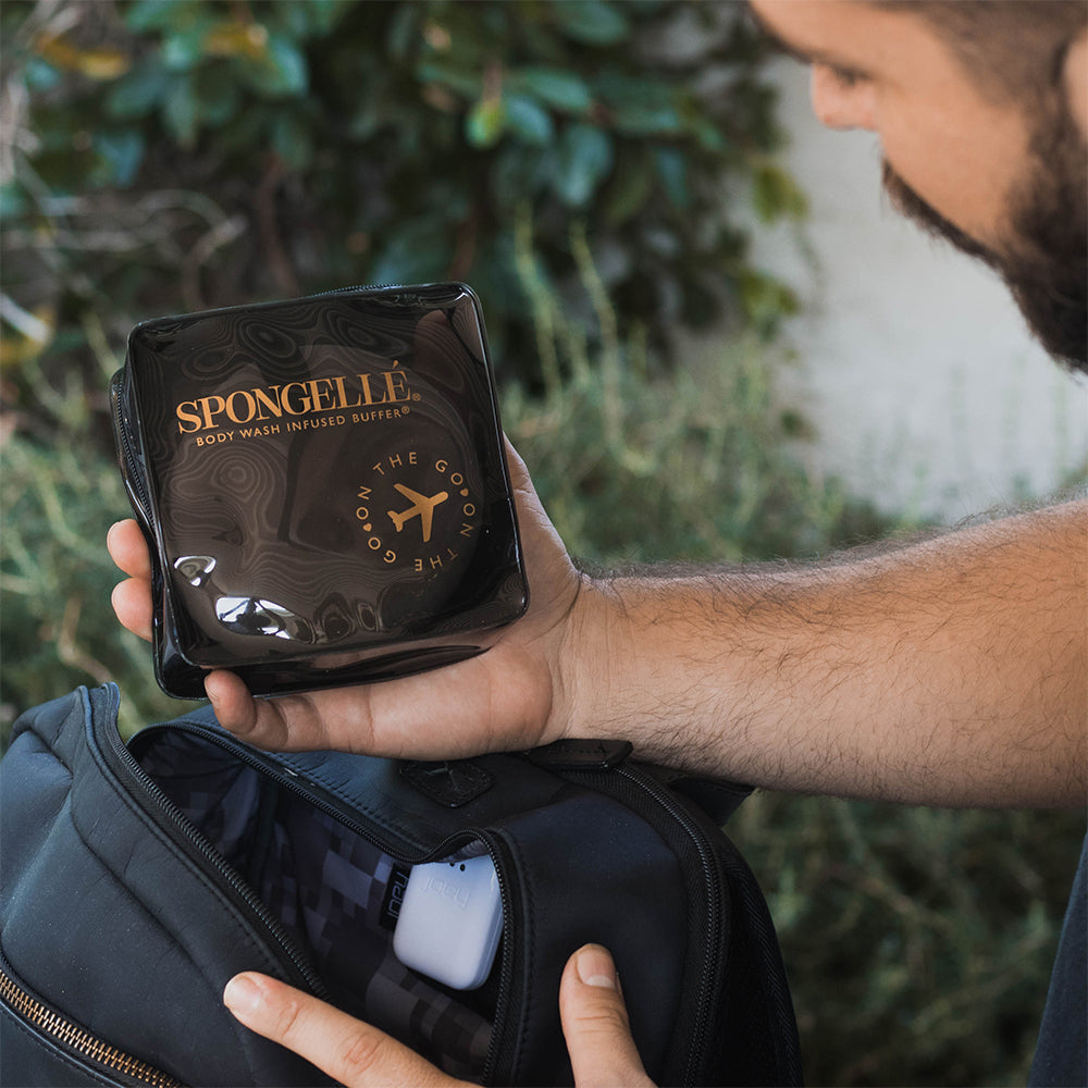 Angled front view with bag zipped and handles upright.